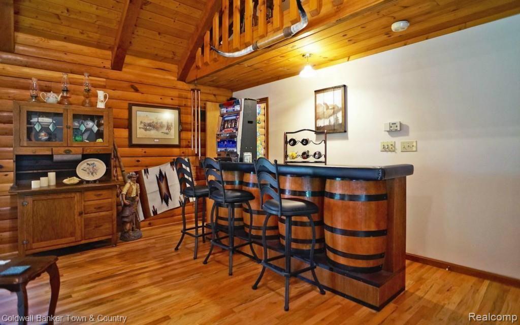 6255 North Owosso Road Fowlerville, MI 48836 - Photo 10 of 31 Entertainment Bar area in Great Room - Barrel Bar and Stools stay with house
