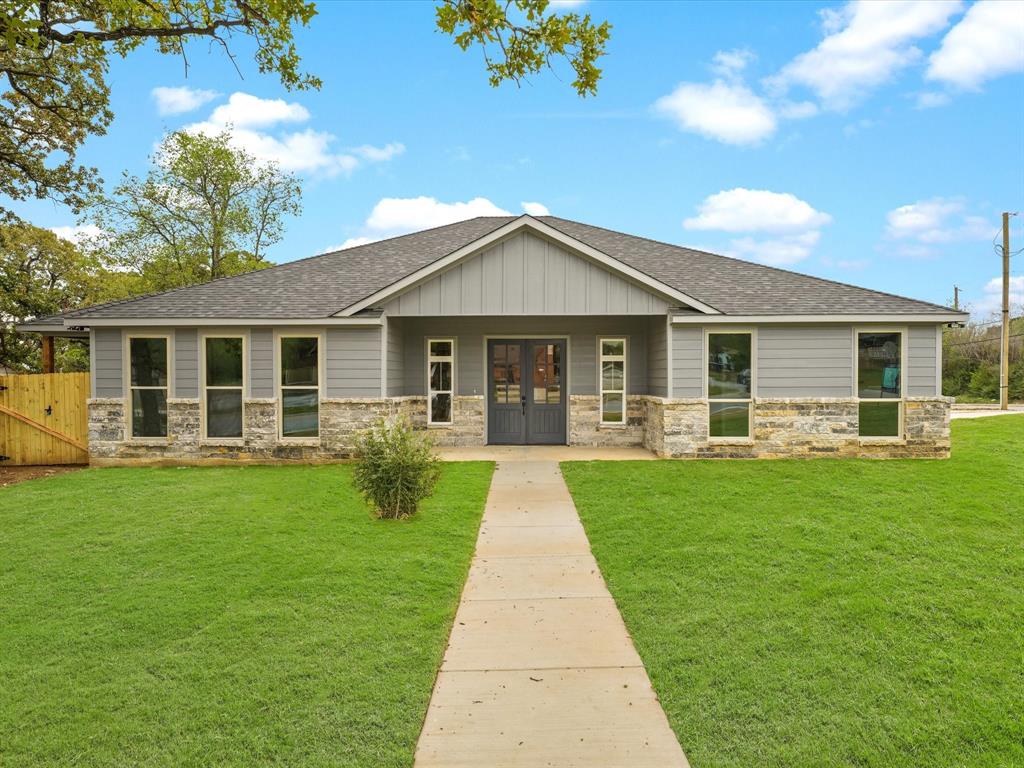 a front view of a house with a yard
