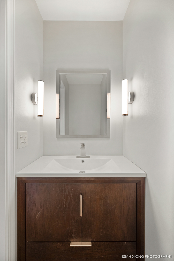 2S203 Green Road Elburn, IL 60119 - Photo 16 of 30 a bathroom with a sink a mirror and vanity