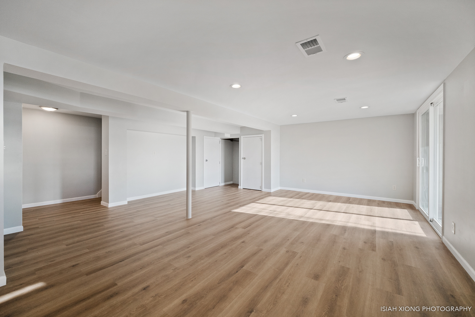 2S203 Green Road Elburn, IL 60119 - Photo 18 of 30 a view of an empty room with wooden floor and a window