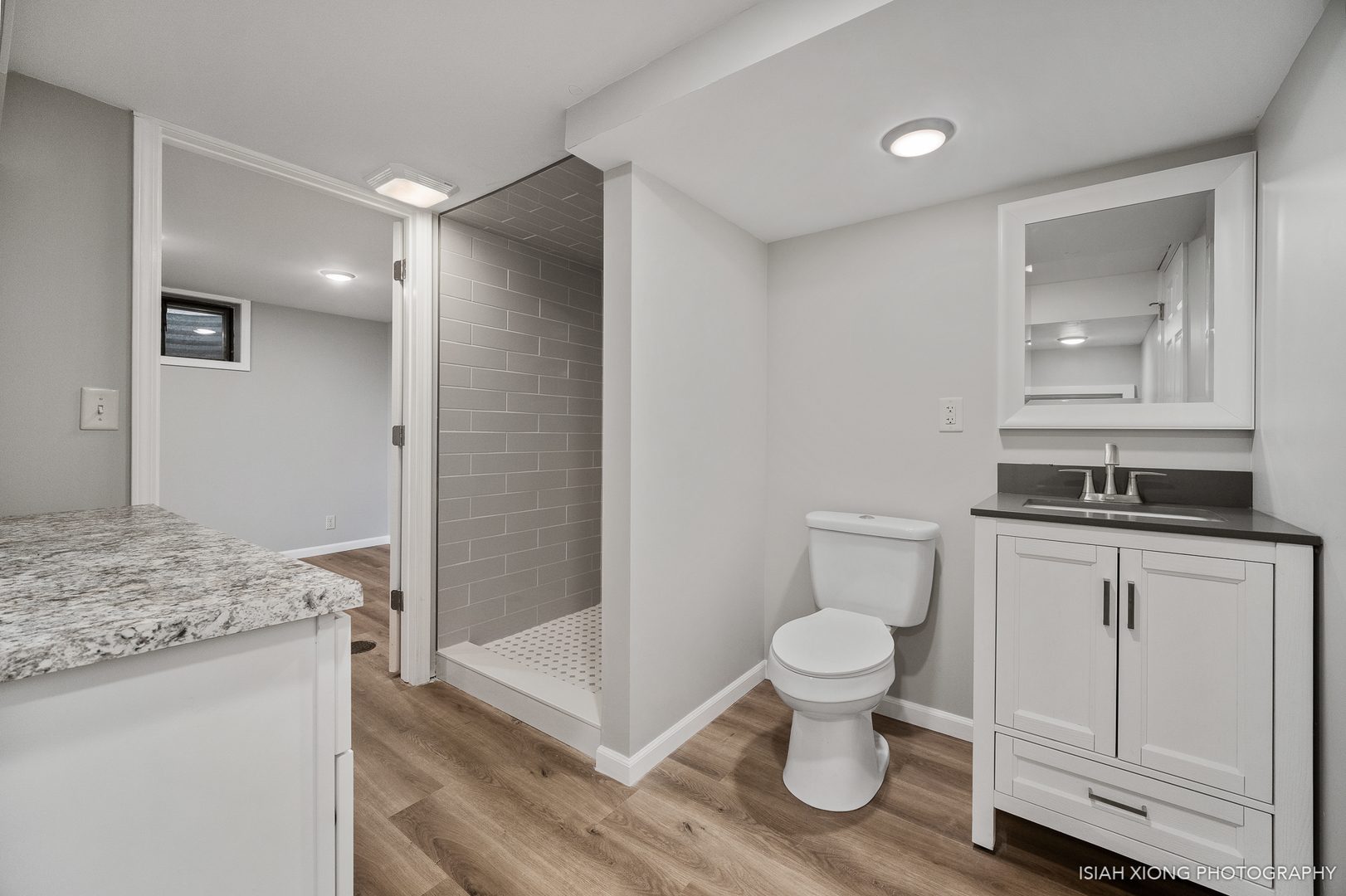 2S203 Green Road Elburn, IL 60119 - Photo 21 of 30 a bathroom with a sink a toilet and shower