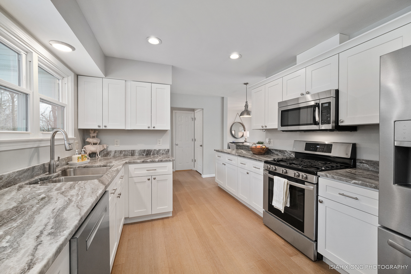 2S203 Green Road Elburn, IL 60119 - Photo 4 of 30 a kitchen with stainless steel appliances granite countertop a stove top oven a sink dishwasher a refrigerator and white cabinets with wooden floor