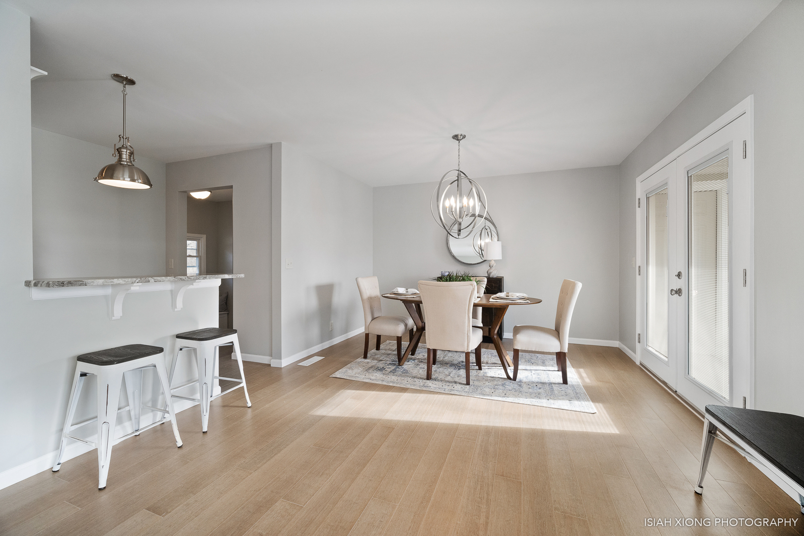 2S203 Green Road Elburn, IL 60119 - Photo 7 of 30 a view of a dining room with furniture and wooden floor