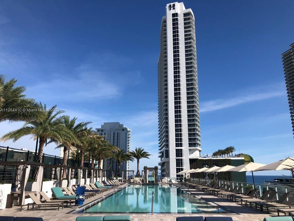 4010 South Ocean Drive, Unit R3106 Hollywood, FL 33019 - Photo 1 of 19 a view of tall buildings and a street