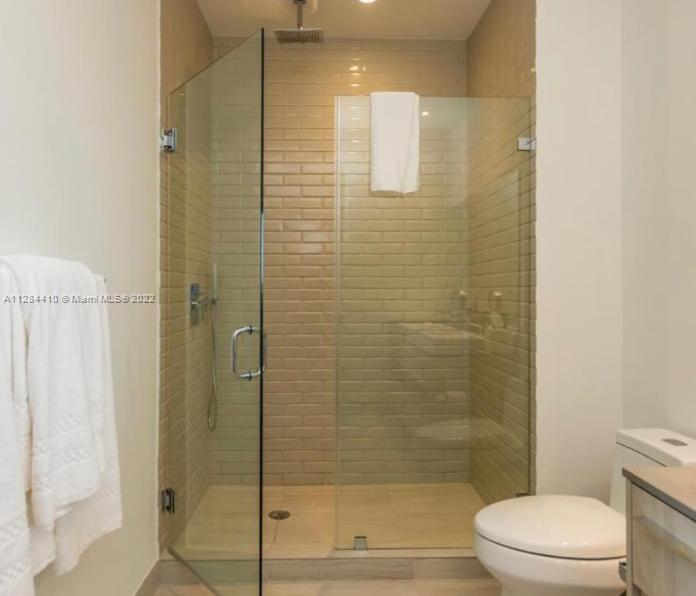 4010 South Ocean Drive, Unit R3106 Hollywood, FL 33019 - Photo 11 of 19 a bathroom with a shower and a toilet