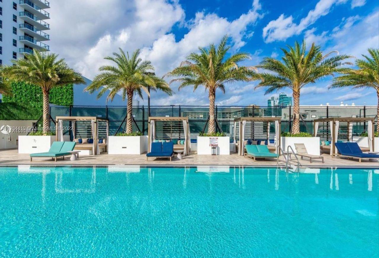 4010 South Ocean Drive, Unit R3106 Hollywood, FL 33019 - Photo 13 of 19 a view of a house with swimming pool and sitting area