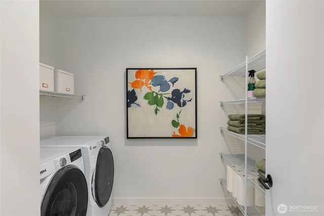 a view of a storage & utility room with a washer and dryer