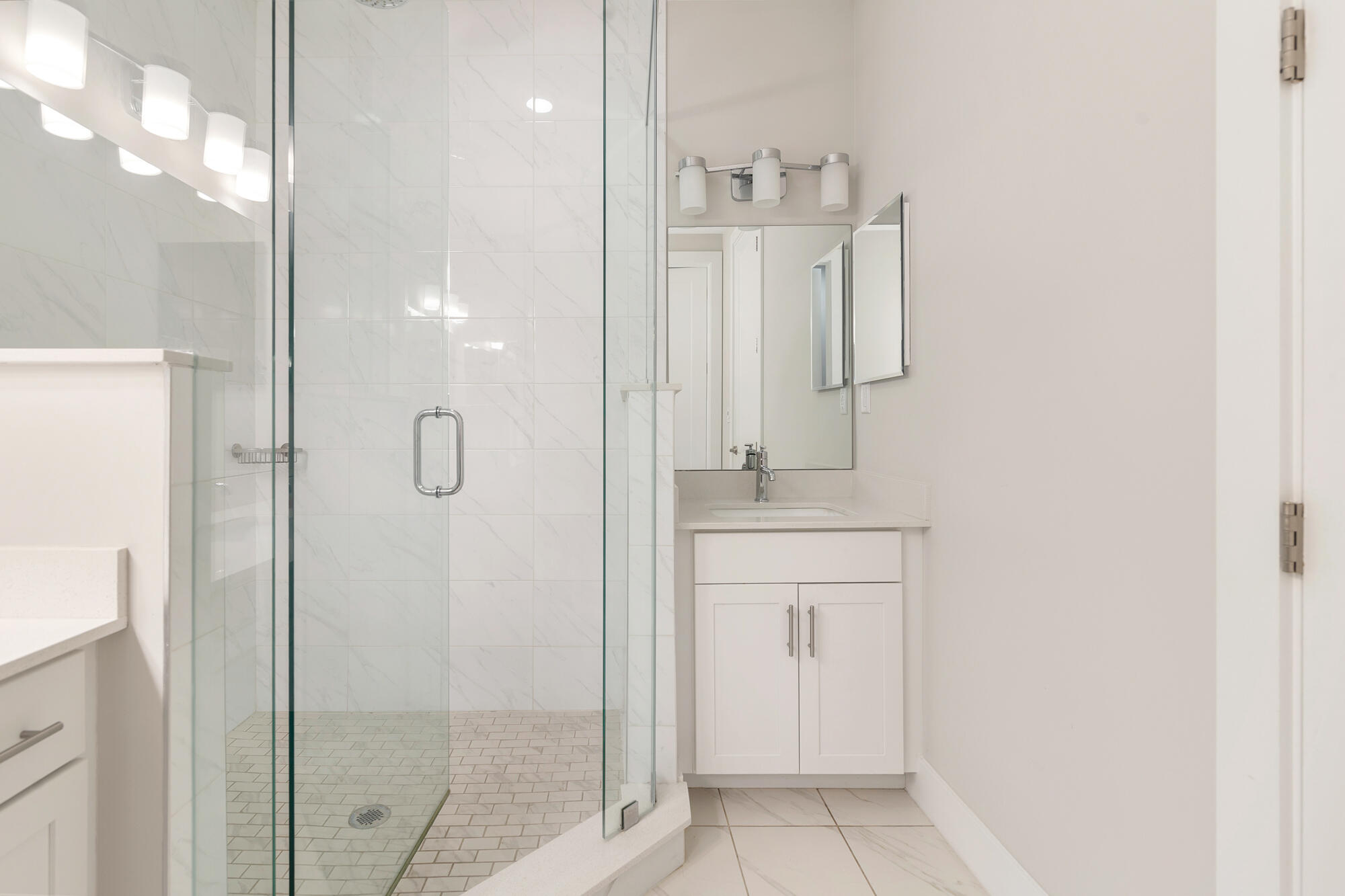 3764 Lambert Avenue West Palm Beach, FL 33405 - Photo 17 of 25 a bathroom with a shower sink and mirror