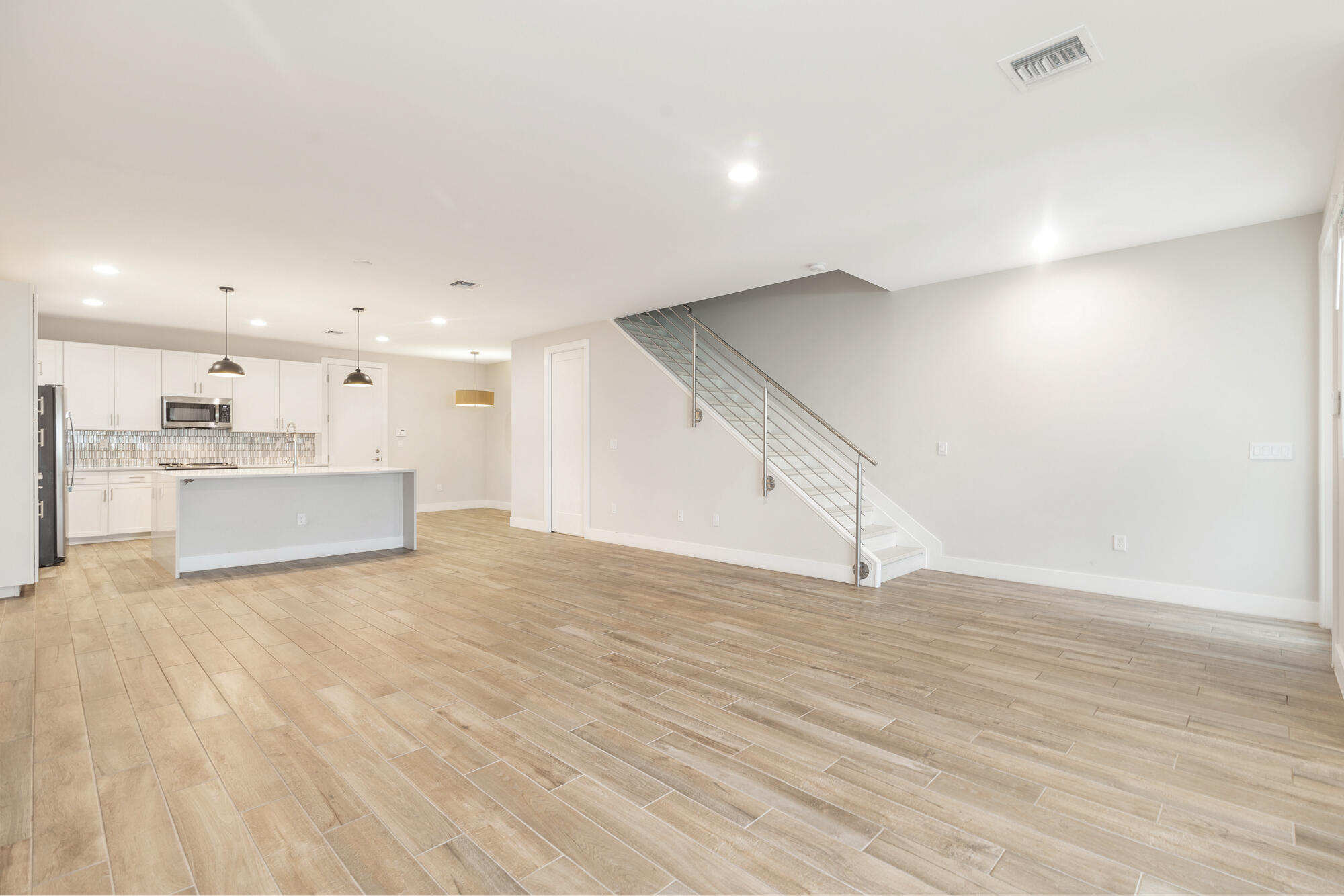 3764 Lambert Avenue West Palm Beach, FL 33405 - Photo 4 of 25 a view of a kitchen with a sink and a refrigerator