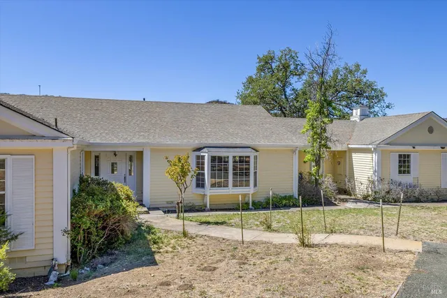 a house view with a backyard space