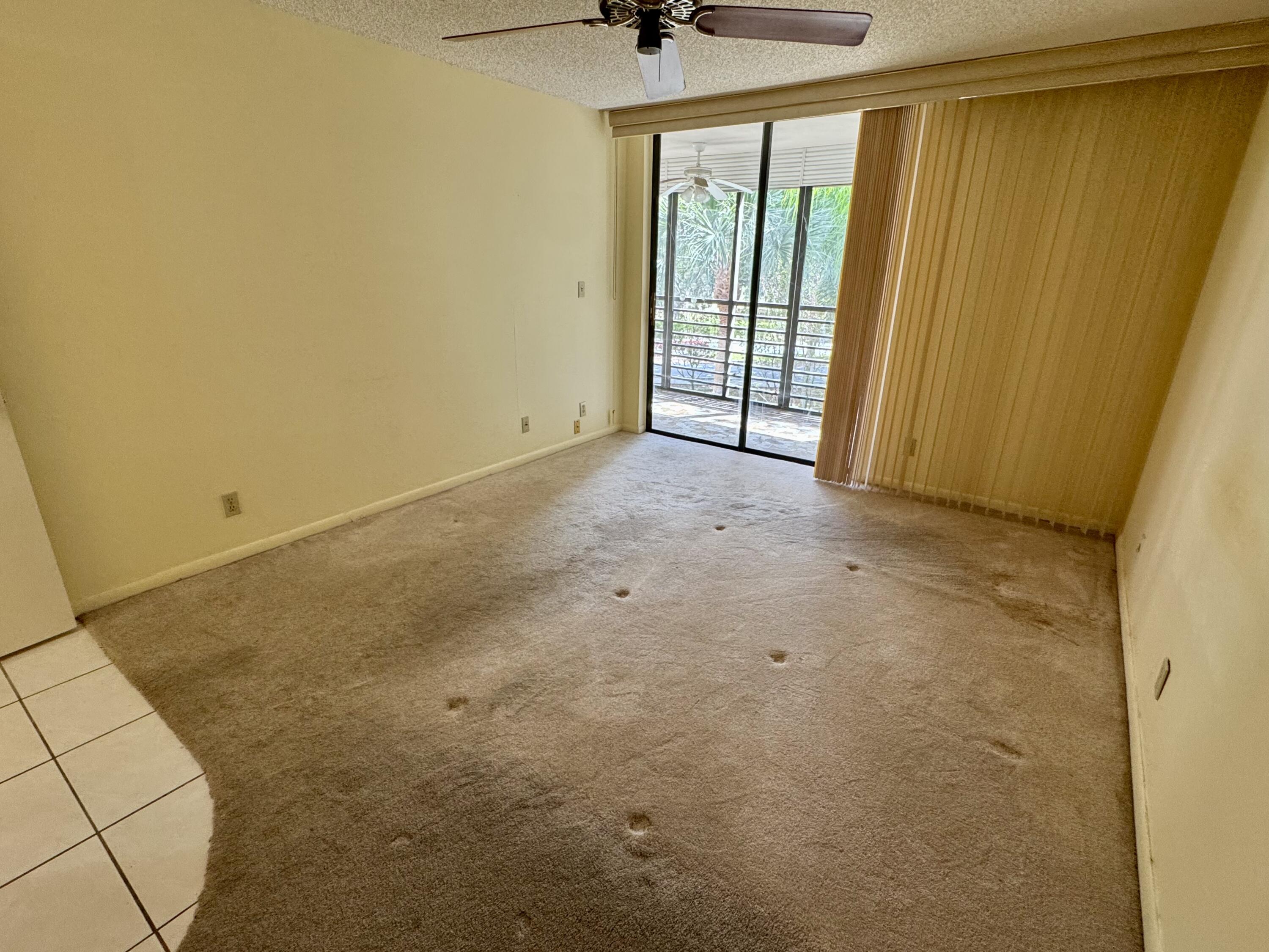 8050 West McNab Road, Unit 320 Tamarac, FL 33321 - Photo 12 of 24 a view of an empty room with a window