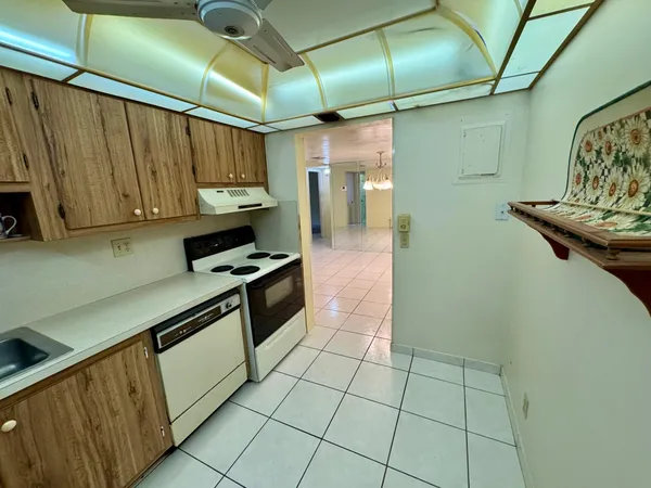 a kitchen with stainless steel appliances granite countertop a sink and a cabinets