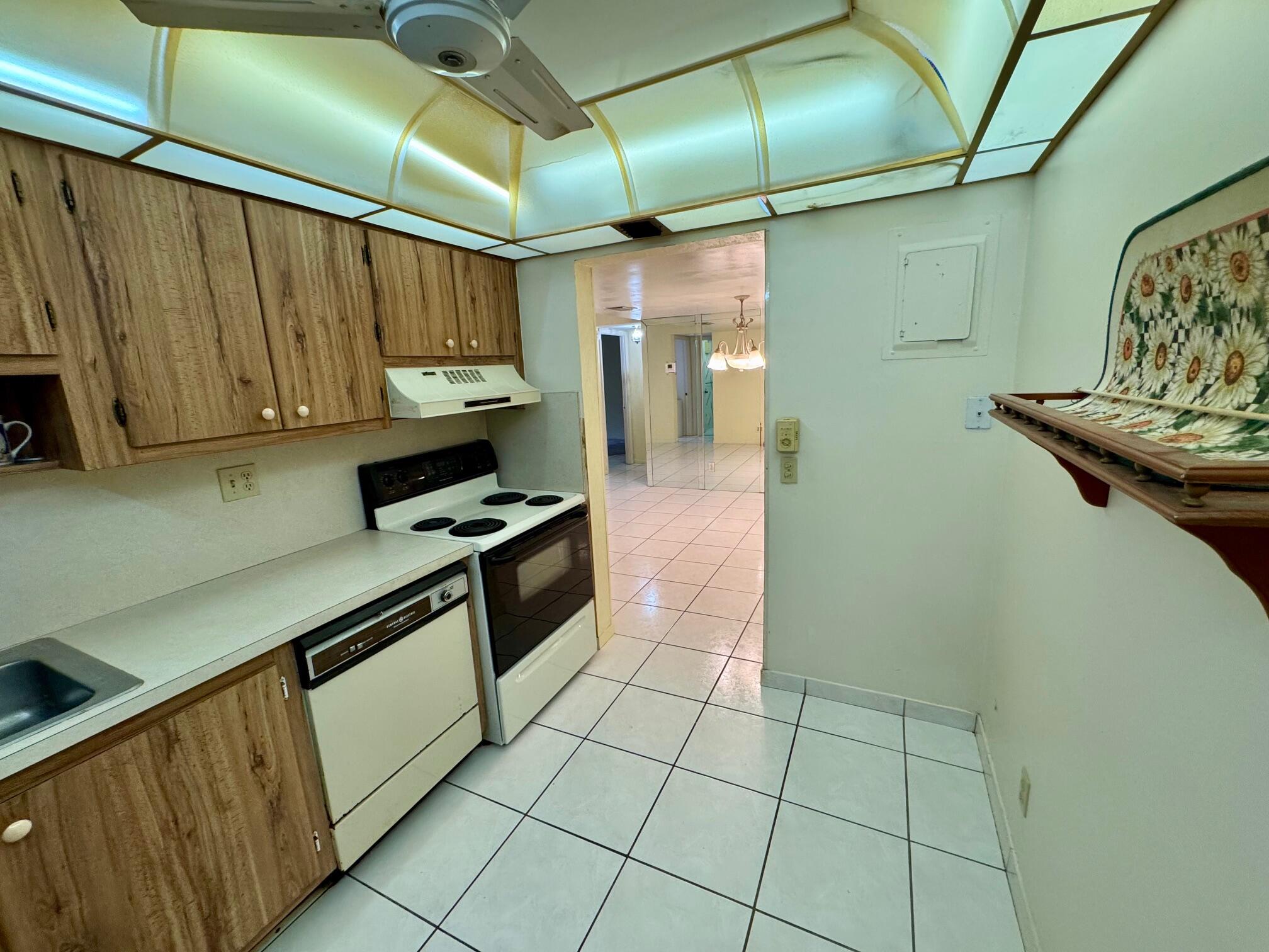 8050 West McNab Road, Unit 320 Tamarac, FL 33321 - Photo 3 of 24 a kitchen with stainless steel appliances granite countertop a sink and a cabinets