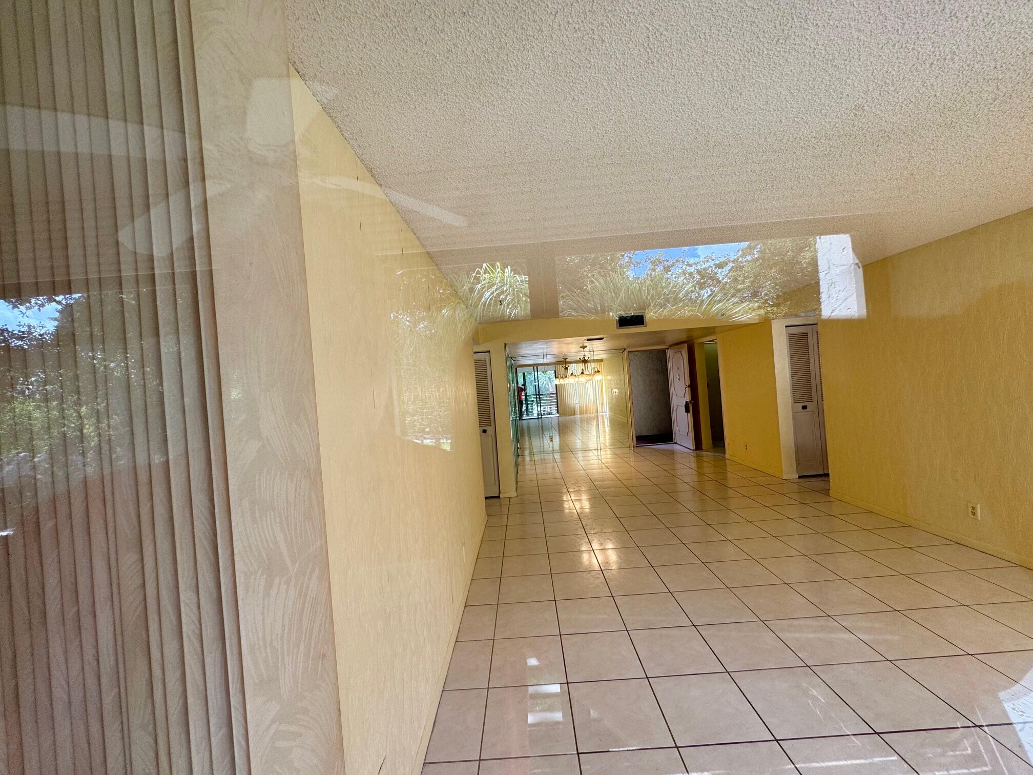 8050 West McNab Road, Unit 320 Tamarac, FL 33321 - Photo 6 of 24 a view of a hallway