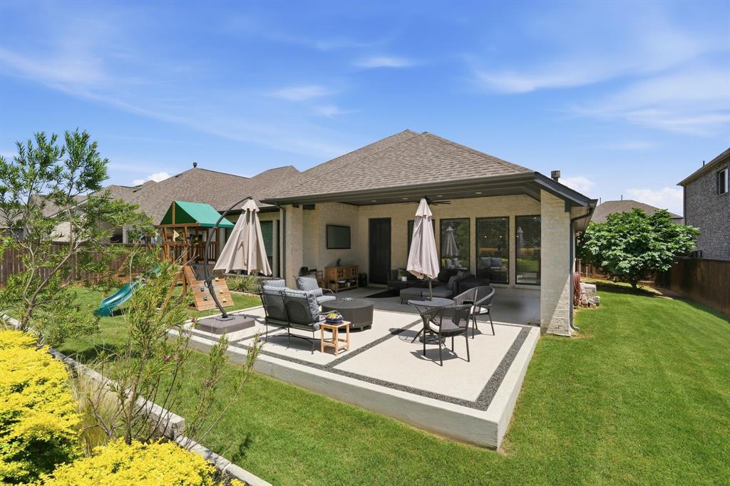 904 Fallbrook Avenue Denton, TX 76210 - Photo 26 of 30 a view of a house with backyard porch and patio