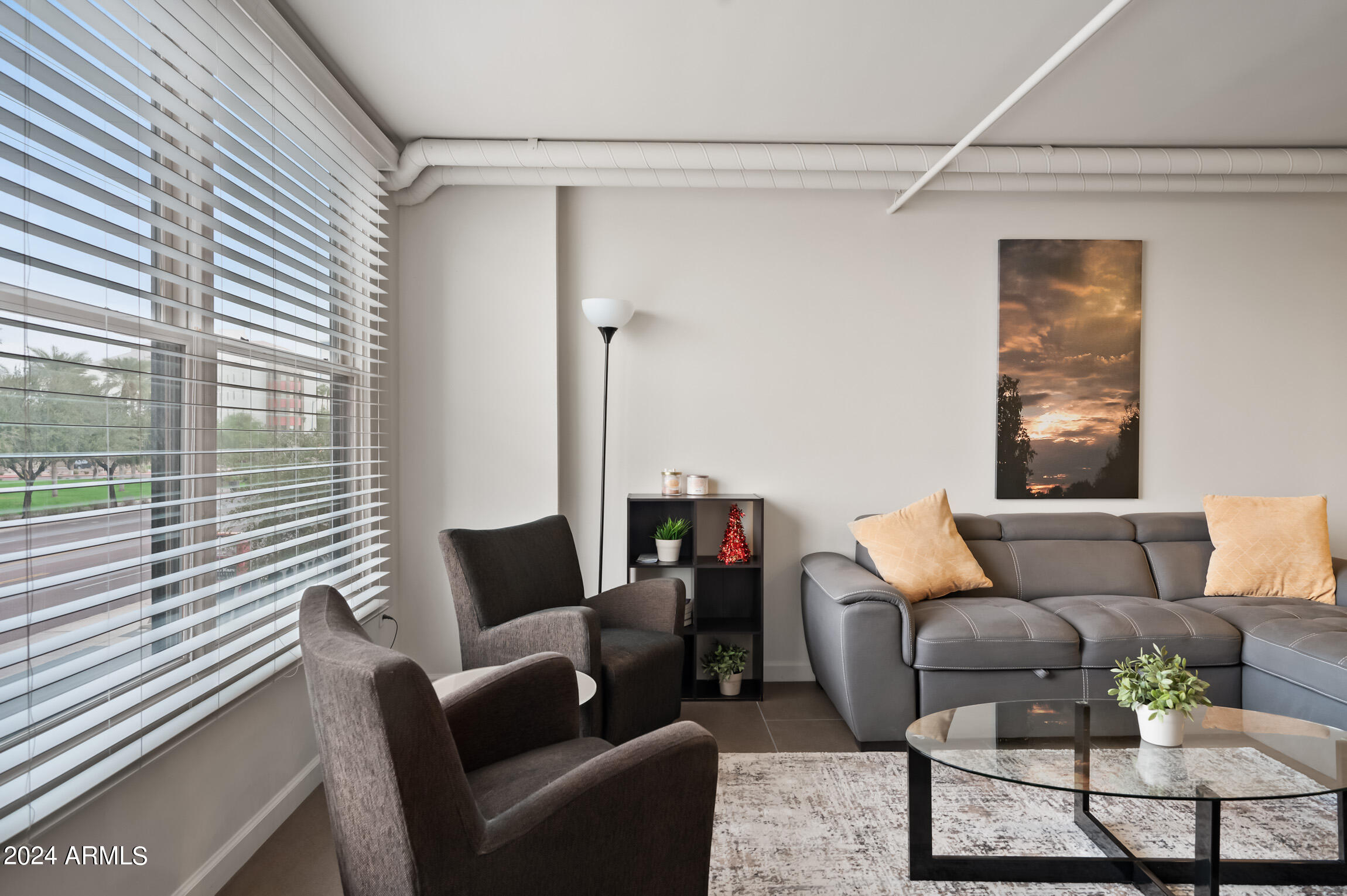535 West Thomas Road, Unit 212 Phoenix, AZ 85013 - Photo 14 of 18 a living room with furniture and a window