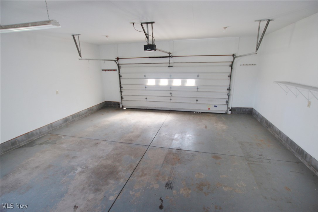 1031 Georgetown Road Salem, OH 44460 - Photo 20 of 31 Garage featuring a garage door opener and baseboards