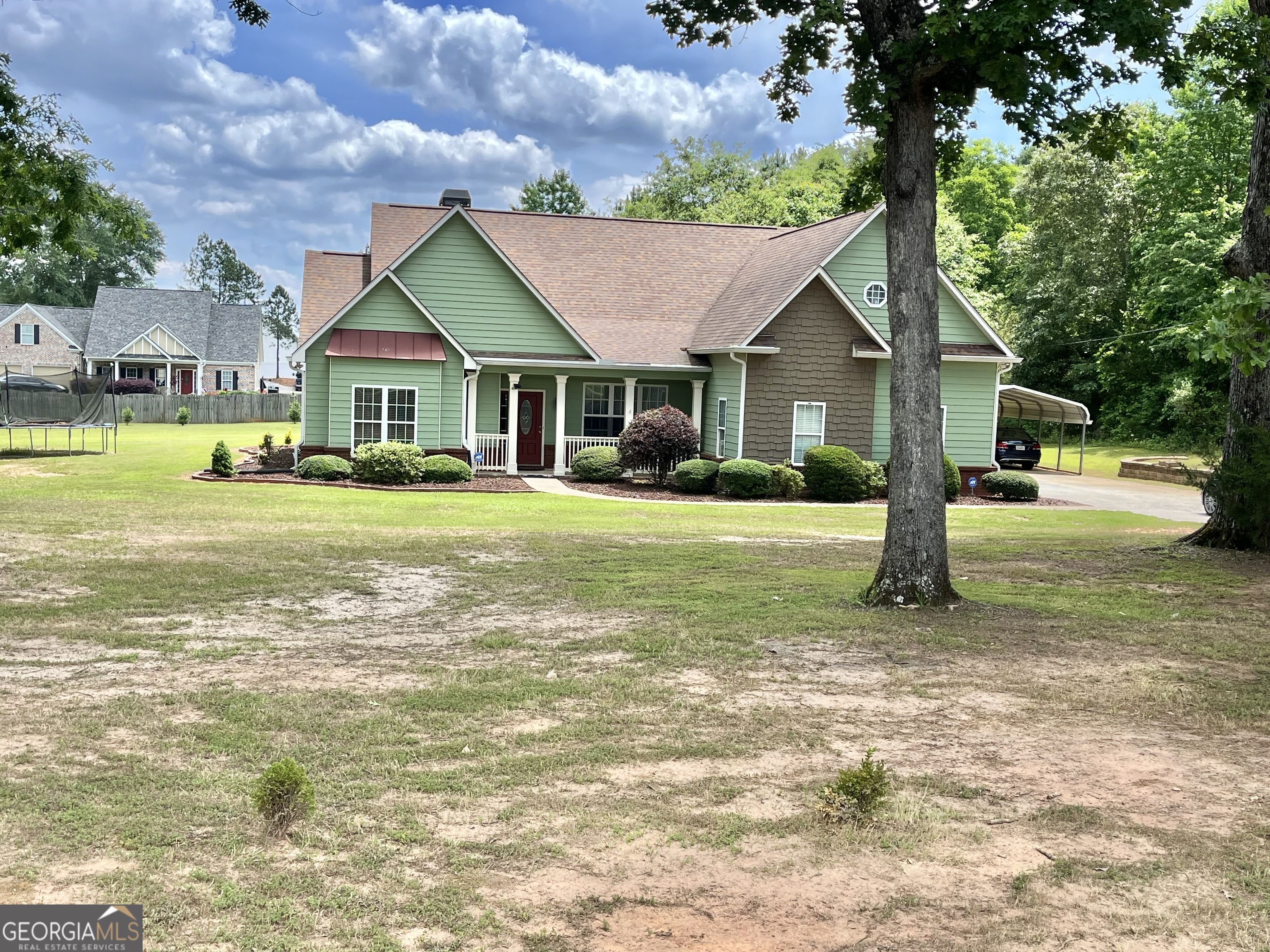 235 Babbs Mill Road Hampton, GA 30228 - Photo 1 of 1 a front view of a house with a yard