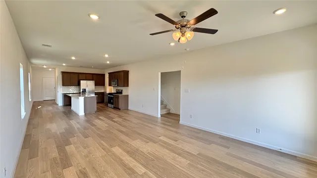 a view of kitchen with cabinets
