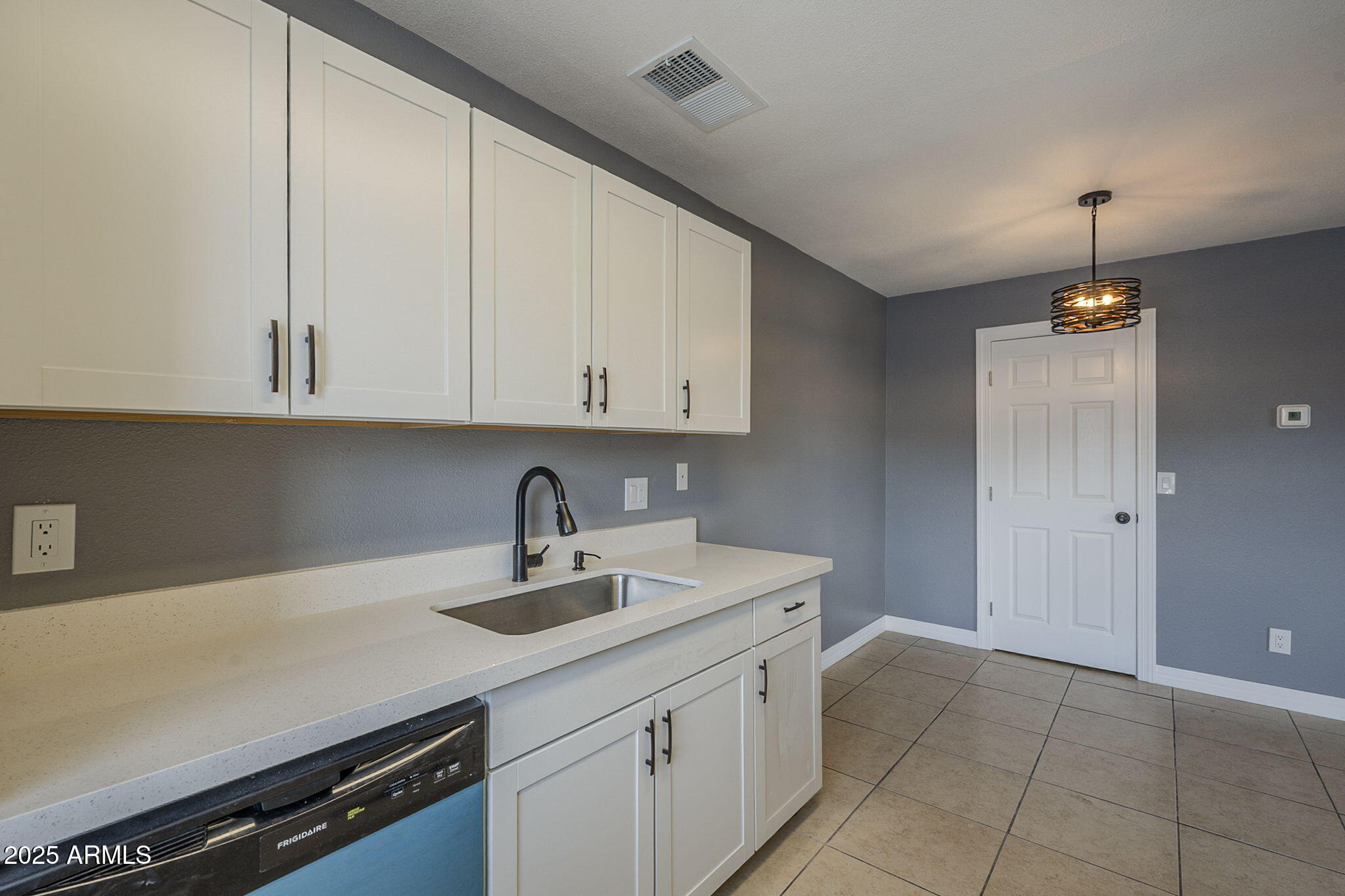 3511 East Baseline Road, Unit 1033 Phoenix, AZ 85042 - Photo 16 of 27 a kitchen with a sink and cabinets
