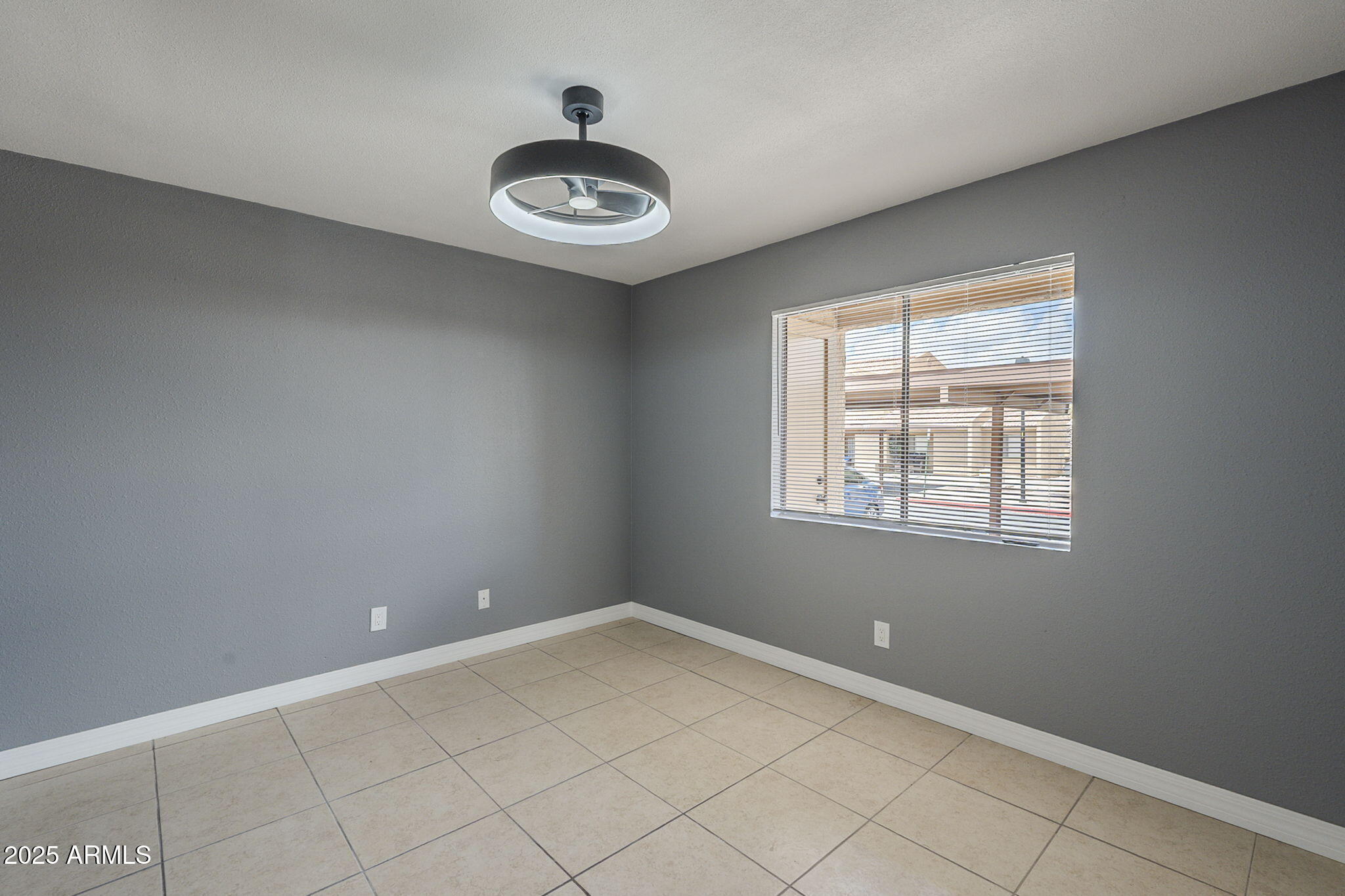3511 East Baseline Road, Unit 1033 Phoenix, AZ 85042 - Photo 18 of 27 an empty room with a window