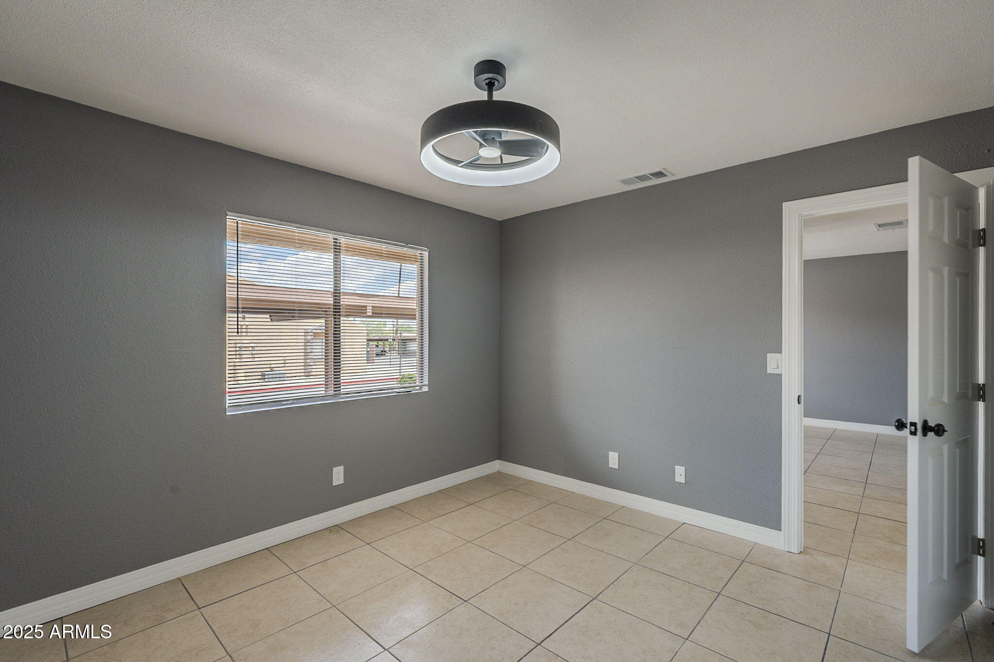 3511 East Baseline Road, Unit 1033 Phoenix, AZ 85042 - Photo 20 of 27 a view of a livingroom with a window