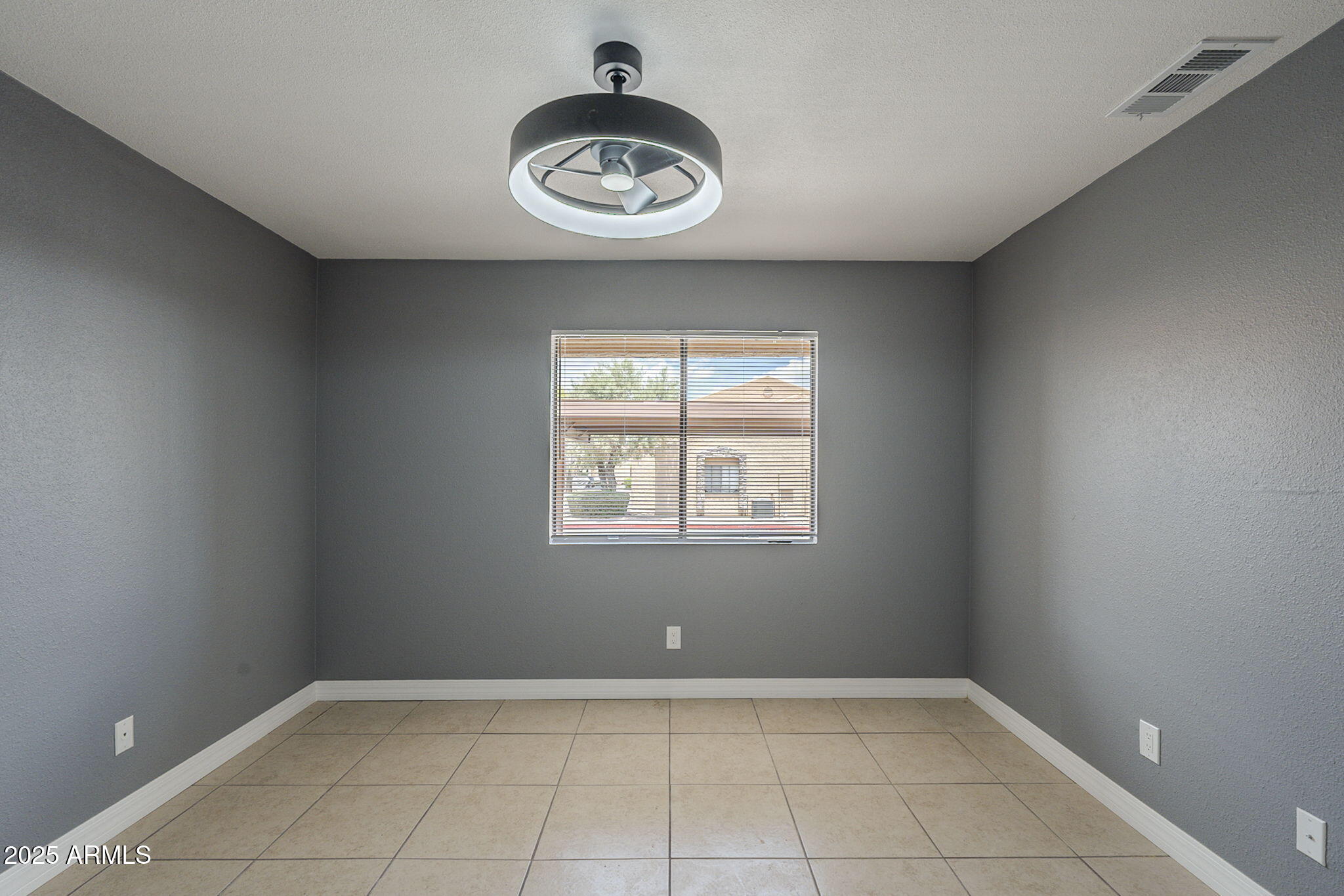 3511 East Baseline Road, Unit 1033 Phoenix, AZ 85042 - Photo 23 of 27 an empty room with a window