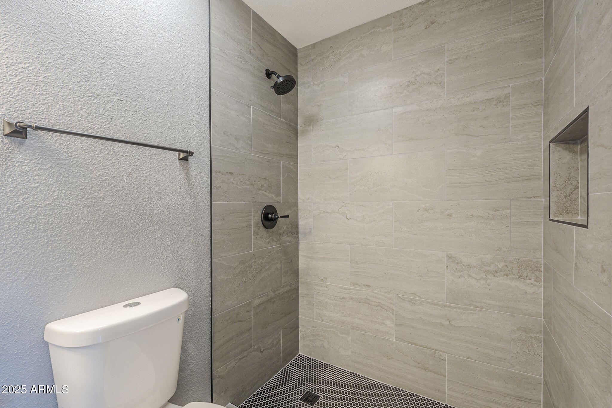3511 East Baseline Road, Unit 1033 Phoenix, AZ 85042 - Photo 25 of 27 a bathroom with a toilet and shower