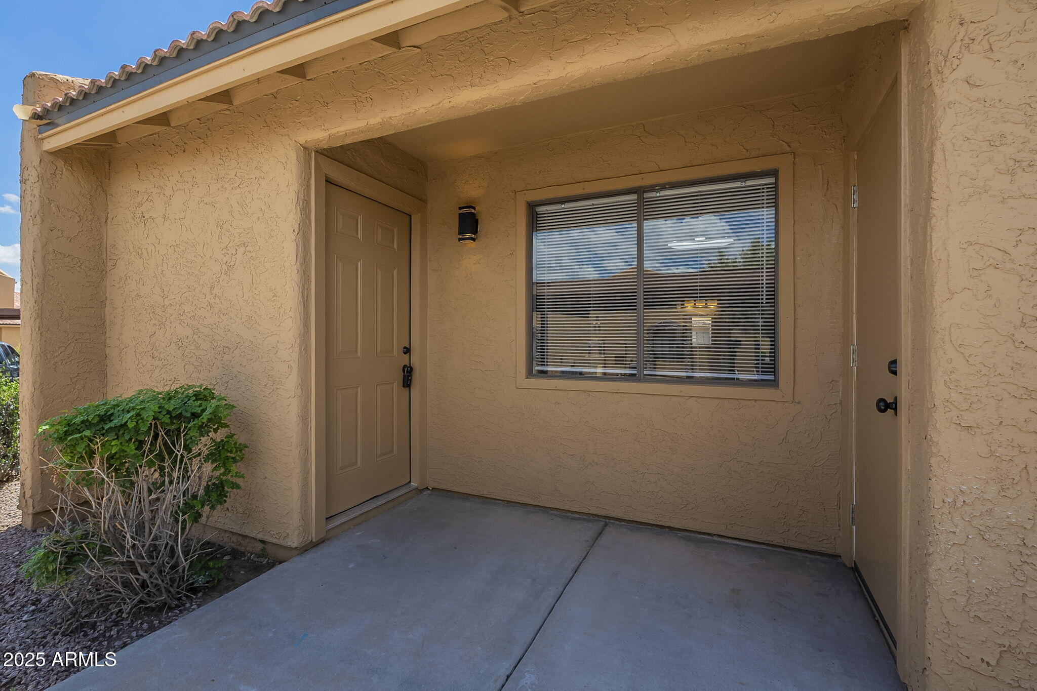 3511 East Baseline Road, Unit 1033 Phoenix, AZ 85042 - Photo 3 of 27 a view of an empty room with a window