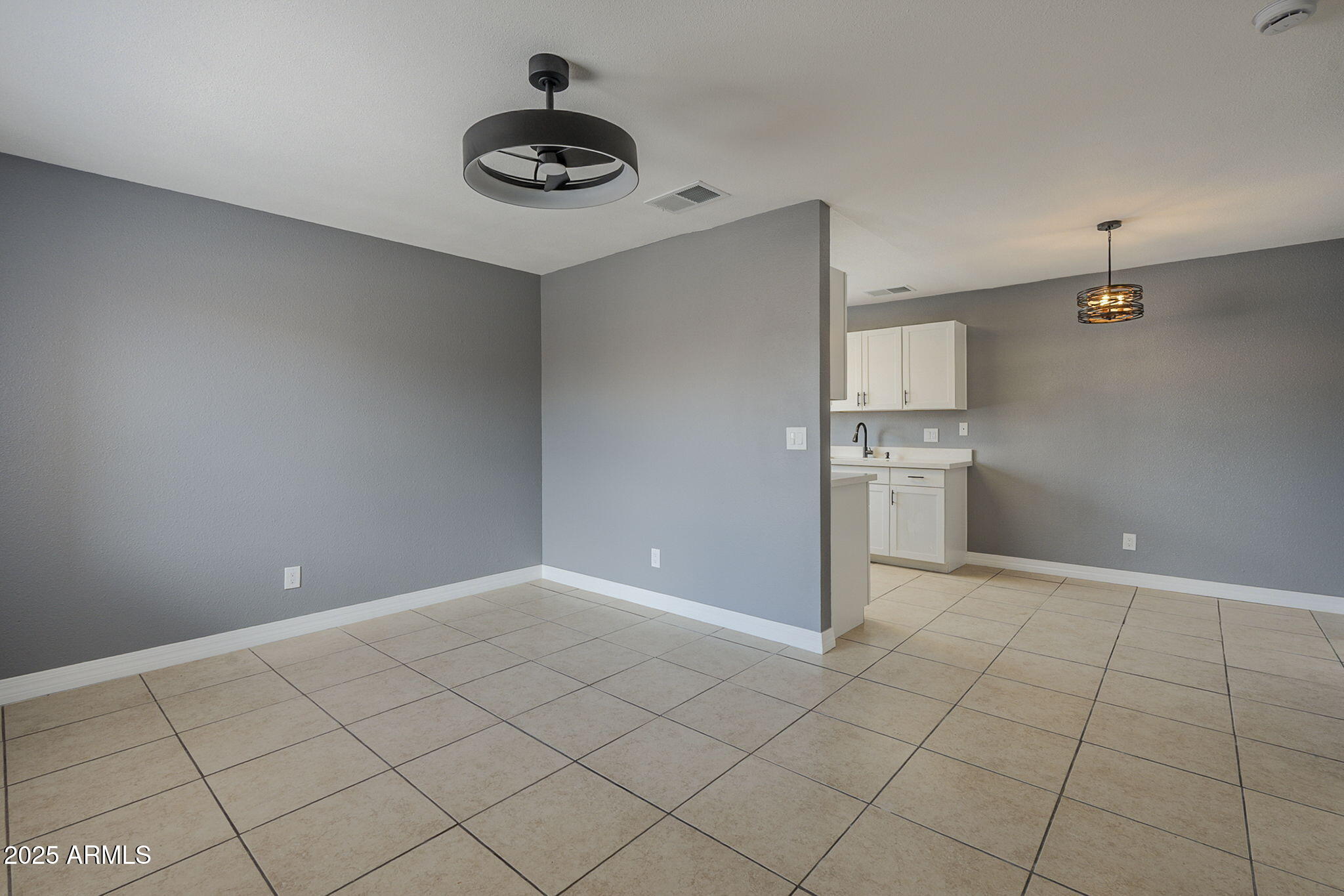 3511 East Baseline Road, Unit 1033 Phoenix, AZ 85042 - Photo 5 of 27 a view of kitchen and window with refrigerator in kitchen