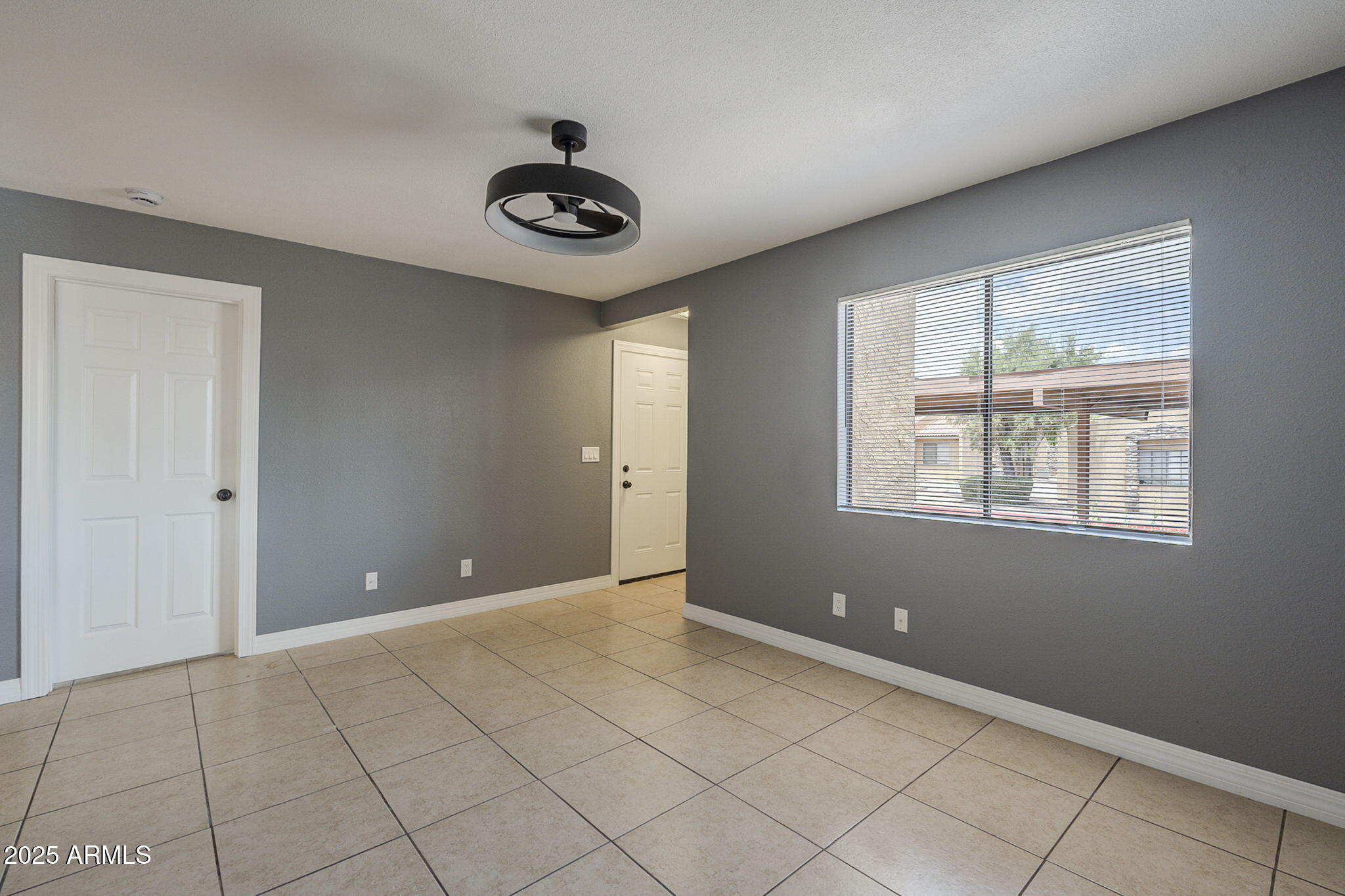 3511 East Baseline Road, Unit 1033 Phoenix, AZ 85042 - Photo 6 of 27 a view of an empty room with a window
