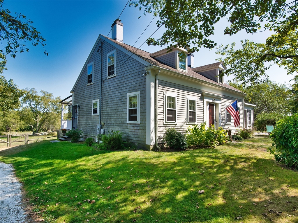 56 Maple Avenue Little Compton, RI 02837 - Photo 1 of 33 a front view of house with yard and green space