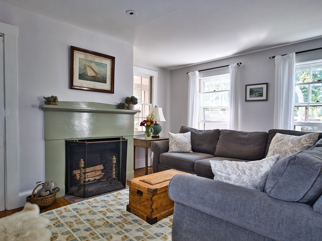 56 Maple Avenue Little Compton, RI 02837 - Photo 13 of 33 a living room with furniture and a fireplace