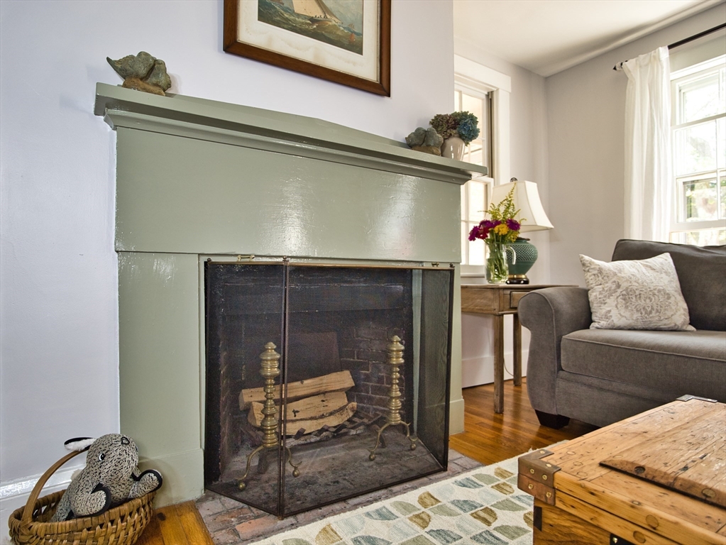 56 Maple Avenue Little Compton, RI 02837 - Photo 14 of 33 a living room with furniture and a fireplace