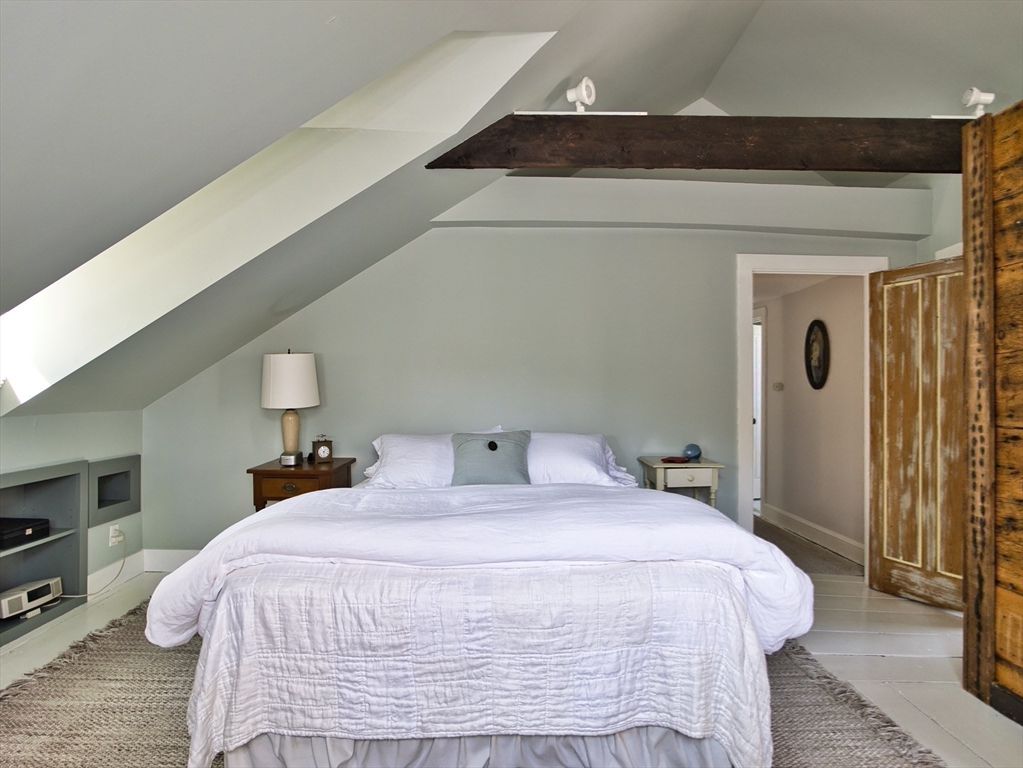 56 Maple Avenue Little Compton, RI 02837 - Photo 21 of 33 a bedroom with a bed and a night stand