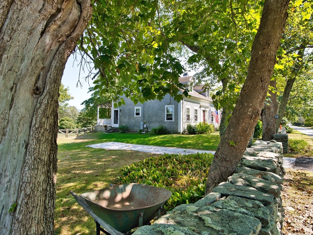 56 Maple Avenue Little Compton, RI 02837 - Photo 27 of 33 a view of a house with backyard and a patio