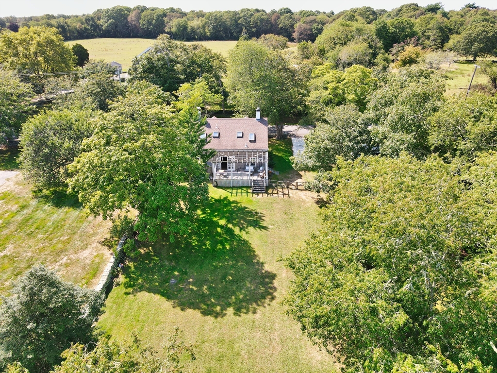 56 Maple Avenue Little Compton, RI 02837 - Photo 28 of 33 a view of a forest with a lake