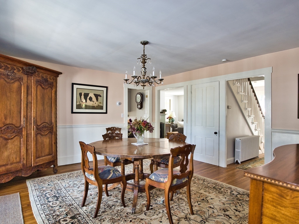 56 Maple Avenue Little Compton, RI 02837 - Photo 9 of 33 a view of a dining room with furniture and wooden floor