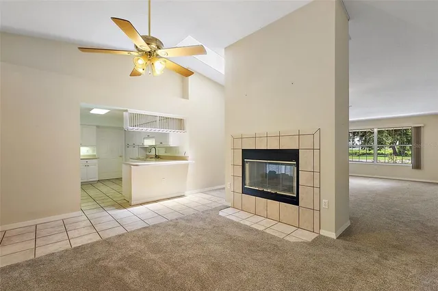 a view of a livingroom with a fireplace and wooden floor