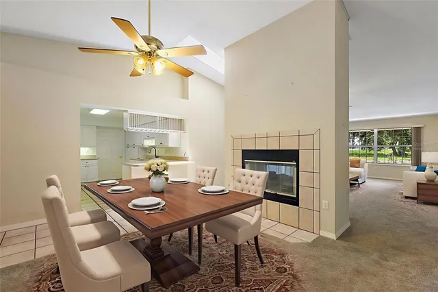 a view of a dining room with a table and chairs