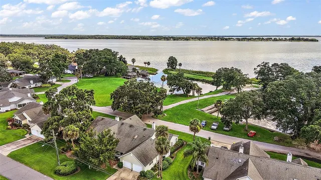 a view of a lake with a garden