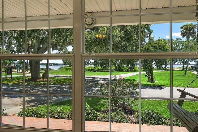 a view of a porch with a floor to ceiling window