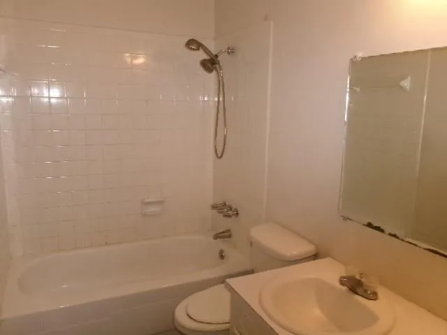 a bathroom with a toilet and shower