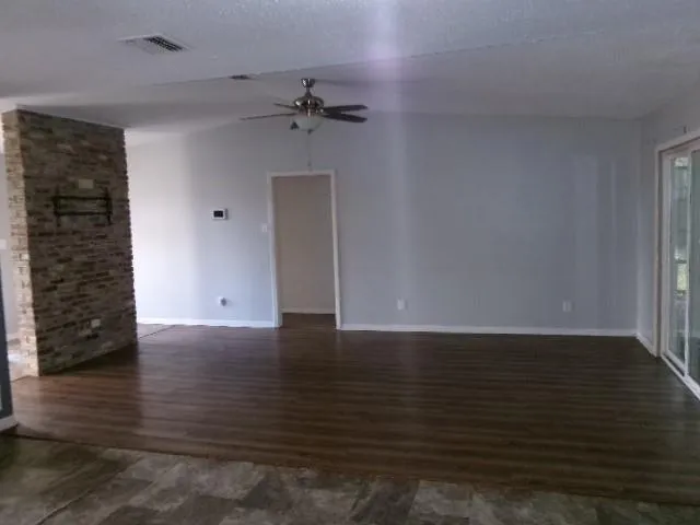 a view of an empty room with a bathroom