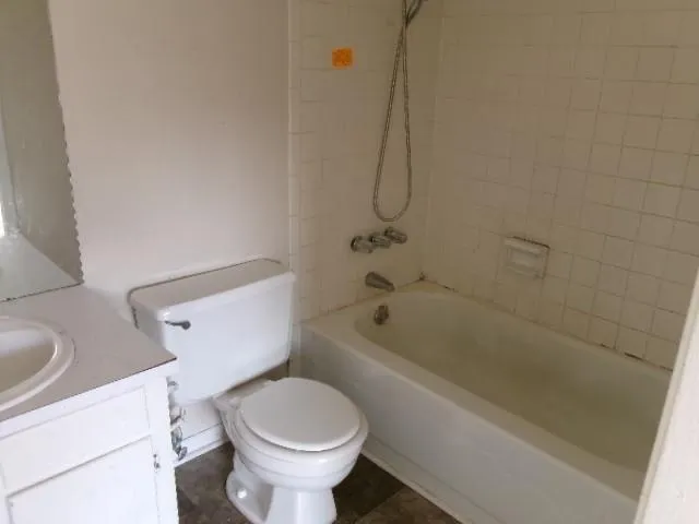 a bathroom with a sink a toilet and a bathtub