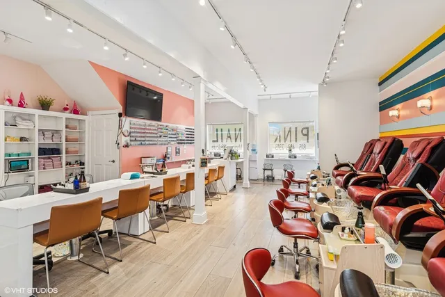 a living room with furniture kitchen view and a large window
