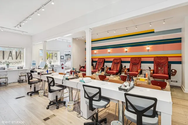 a living room with lots of furniture and a large window