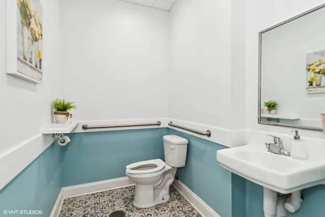 a bathroom with a sink and a toilet
