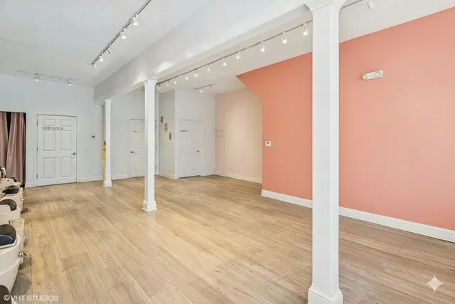 a view of a livingroom with wooden floor