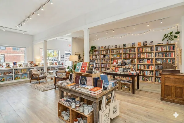 a living room with furniture a rug and a table